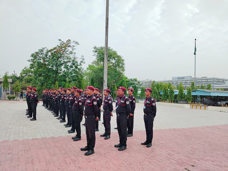 Recruits in red berets drilling in ranks