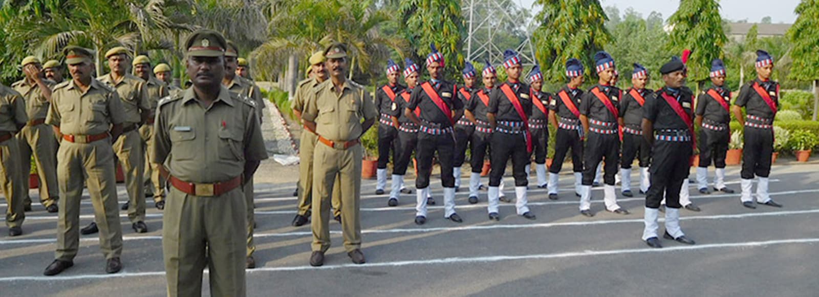 Omax guards on parade alongside uniformed officers