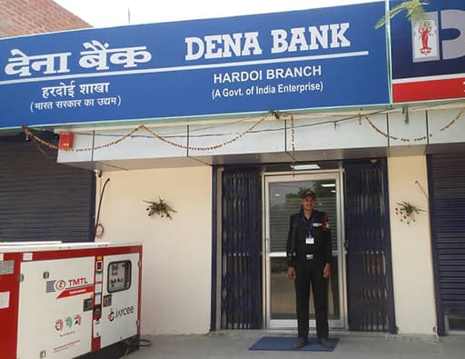 An Omax guard at the entrance of a Dena Bank branch